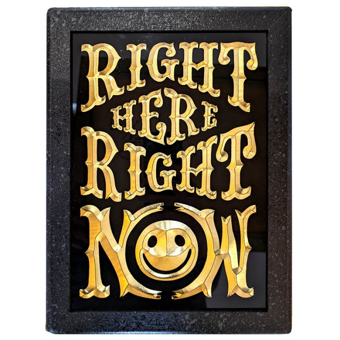 Sculpture artwork by RYCA featuring the phrase 'Right Here Right Now' with a smiley face.